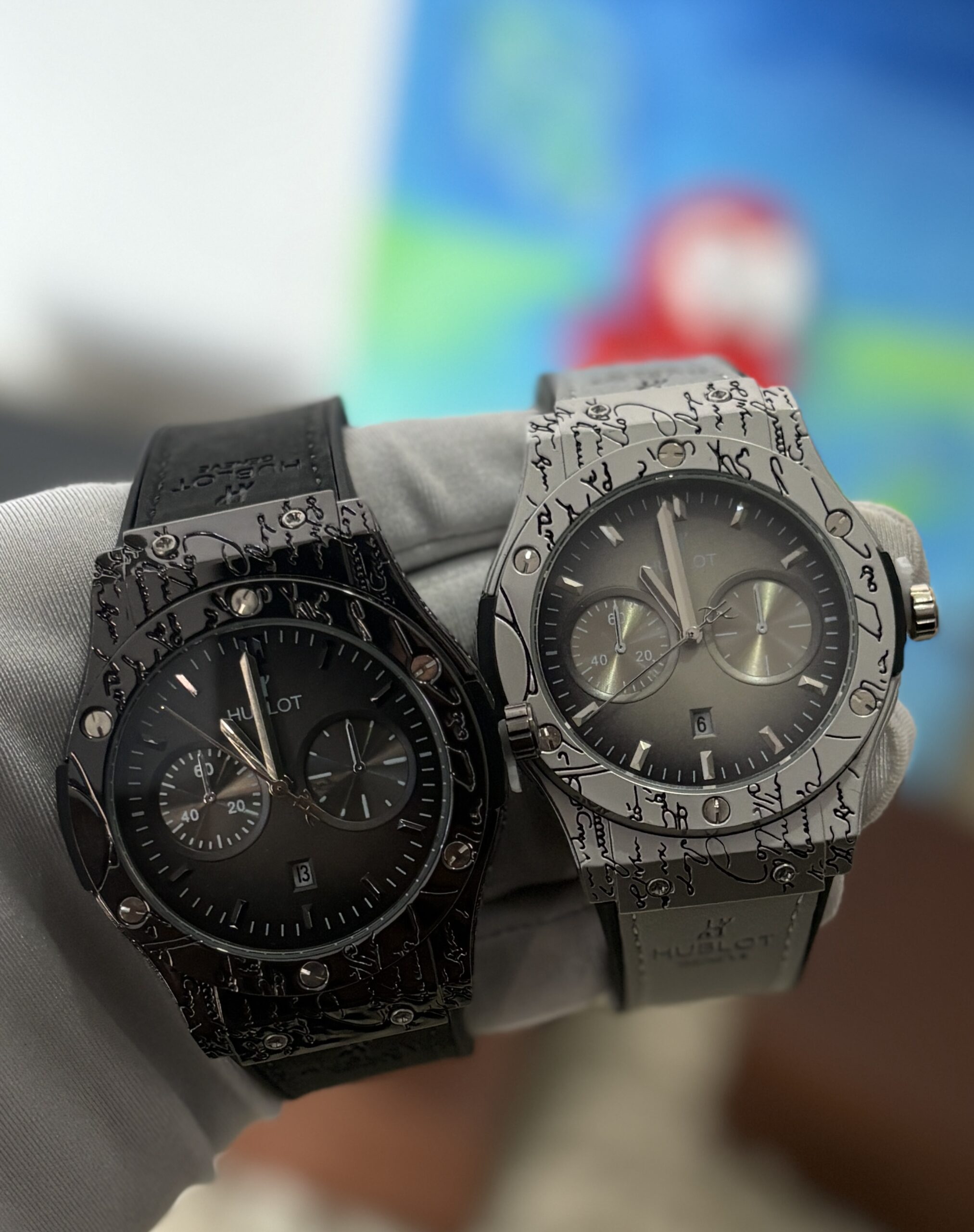 E. 1 FULL BLACK AND 1 GREY HUBLOT (42,000 XAF)